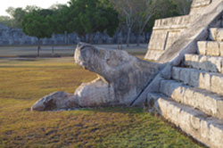 Serpent head at the base of the staircase, Temple of K'uk'ulkan, Chichen Itza.