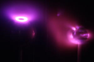 A ring of bright purple plasma around a dark sphere.