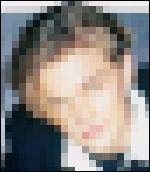 A blurred image of a person's face